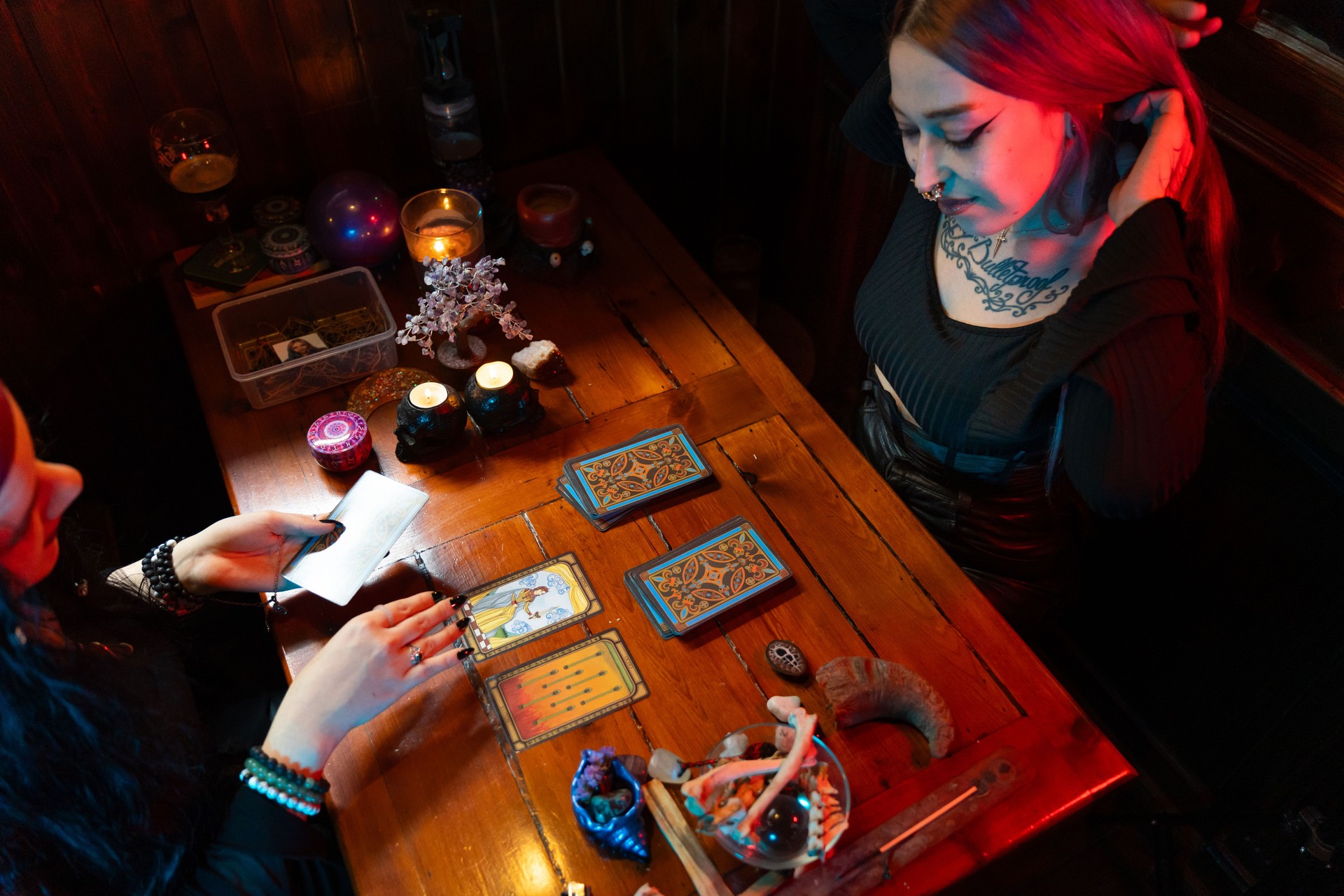 Fortune teller reading tarot cards in mystical atmosphere
